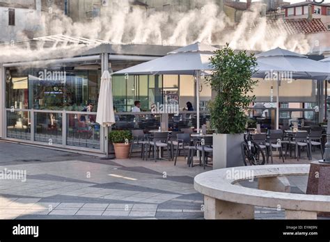 Pula, Croatia. An open-air restaurant using a water mist cooling system ...