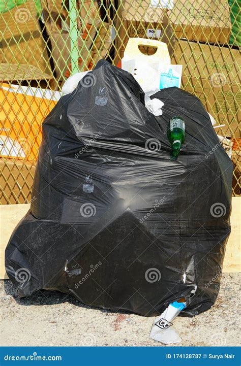 Dubai Uae December 2019 Solo Overflowing Bag Of Black Garbage Trash