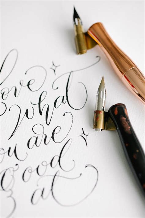 Fountain Pen Use in Calligraphy · Free Stock Photo