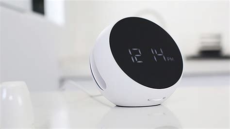 Wake up to a full battery with this alarm clock and wireless charger ...