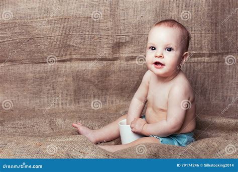 Babe Plays With A Cup Stock Photo Image Of Lifestyle 79174246