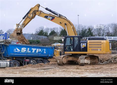 Yellow Crawler Excavator Cat F Ln Loading A Truck On Construction