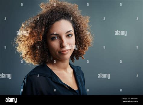 Curly Haired Latina S Expression Captures The Essence Of An Idea Blossoming Into Something