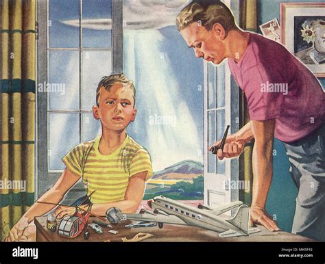 Dad Admires Son Building Model Airplanes Stock Photo Alamy