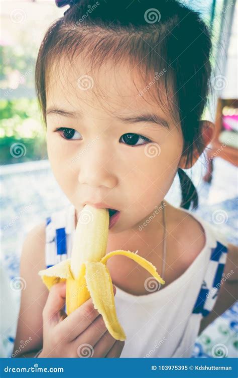 Close Up Asian Girl Peeling And Eating A Ripe Banana Vintage To Stock Image Image Of Cheerful