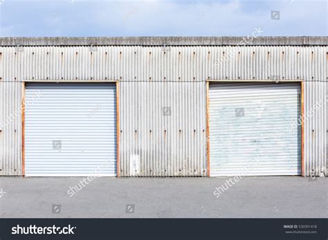 storage unit shutter door roller stock photo edit