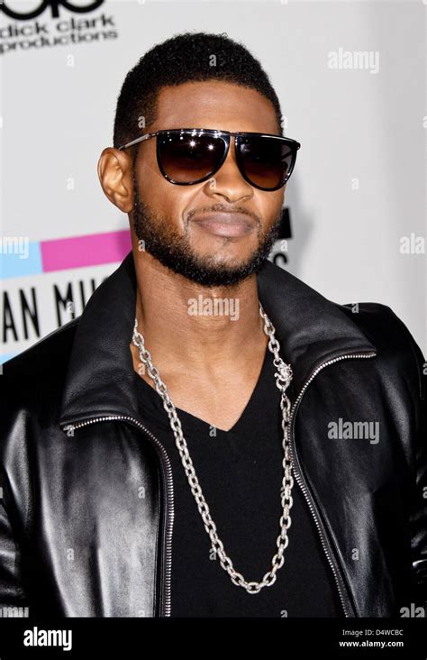 US singer Usher arrives for the 38th Annual American Music Awards in Los Angeles, California ...