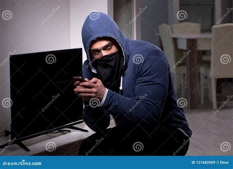 The Burglar Thief Stealing Tv From Apartment House Stock Image Image