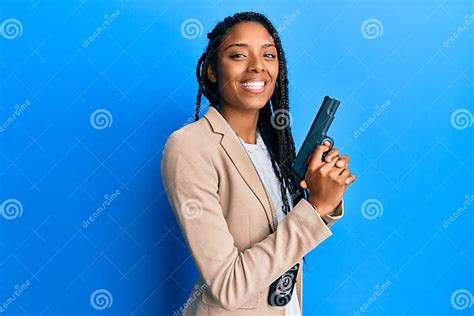 African American Police Woman Holding Gun Smiling With A Happy And Cool