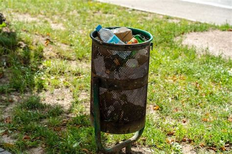 Premium Photo Trash Cans Full With Rubbish In The Street