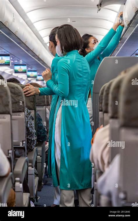 Vietnam Airlines Cabin Crew Wearing Traditional Ao Dai Uniform On