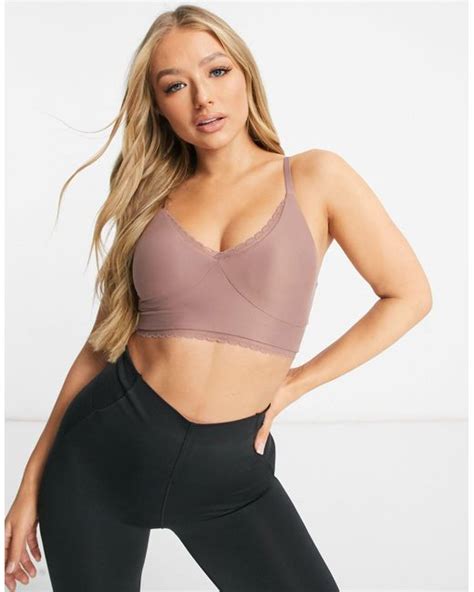 Nike Nike Yoga Indy Luxe Lace Light Support Sports Bra In Pink Lyst