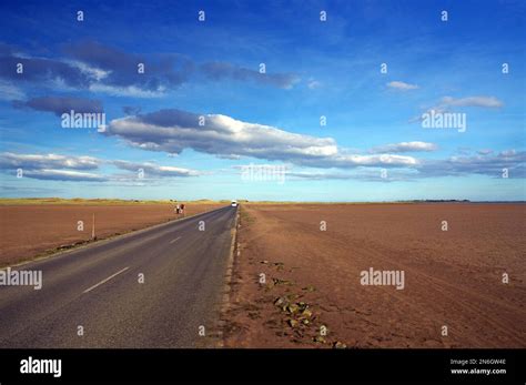 Straight Road Across A Wide Plain Tidal Road Holy Island England