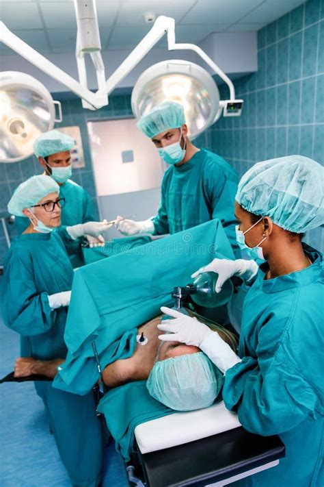 Surgery Team Operating in a Surgical Room Stock Image - Image of ...