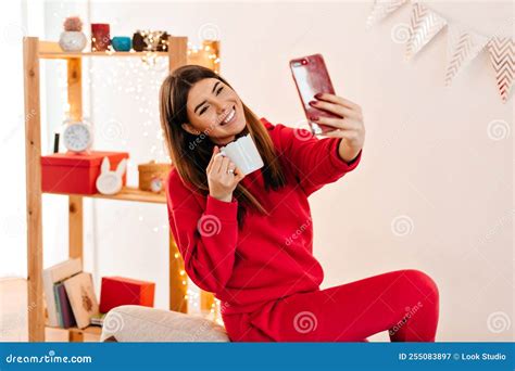 Joyful Woman In Red Attire Taking Selfie At Home Laughing Brunette