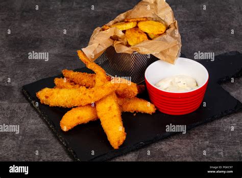 Fish and chips with sauce Stock Photo - Alamy