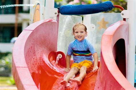 Kids on Water Slide in Aqua Park. Summer Vacation Stock Photo - Image ...