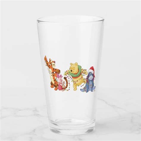 A Glass With Winnie The Pooh Characters On It