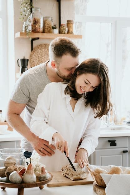 Premium Photo Romantic Young Couple Cooking Together In The Kitchen