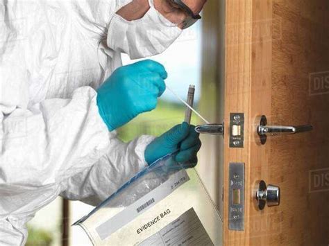 Forensic Officer Taking Dna Swab Off Door Handle Stock Photo Dissolve