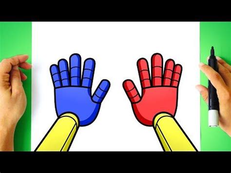 two hands with colored gloves on top of a white piece of paper next to ...