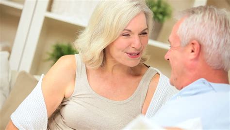 Relaxed Mature Caucasian Couple Enjoying Being Together At Home Stock