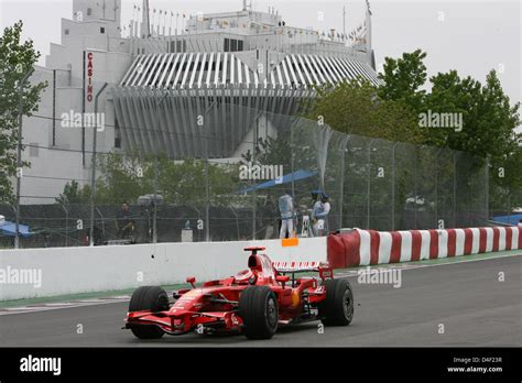 Finnish Formula One Driver Kimi Raikkonen Of Ferrari Steers His Car In