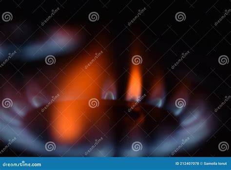 Natural Gas Burning A Blue Flames On Black Background Stock Photo