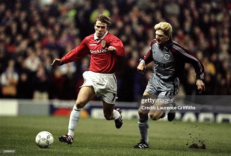 David Beckham of Manchester United is challenged by Stefan Effenberg ...