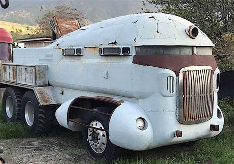 An Old Truck Is Parked In The Grass