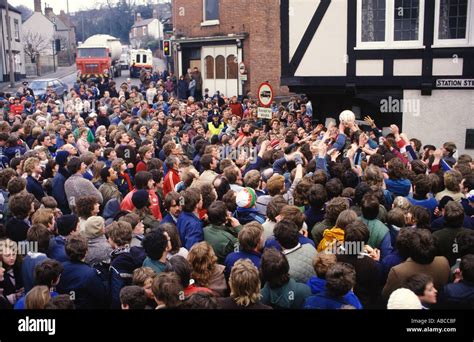 Ashbourne shrovetide football Derbyshire Men fight for the ball in ...