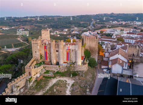 Sunset view of Obidos castle in Portugal Stock Photo - Alamy