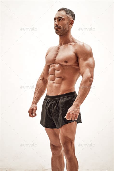 Shirtless Sporty Caucasian Male Isolated On A White Concrete Background