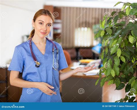 Female Doctor in Surgical Scrubs Standing in Hall Stock Image - Image ...