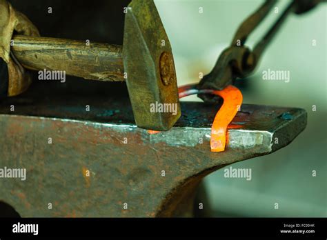 Hammering Glowing Steel To Strike While The Iron Is Hot Stock Photo