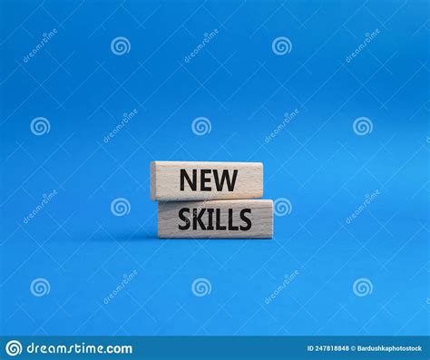 New Skills Symbol Concept Words New Skills On Wooden Blocks Beautiful Blue Background