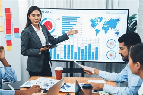 young asian businesswoman presenting data analysis dashboard  tv