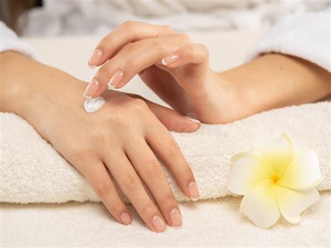 Woman Applies A Cosmetic Moisturizer On Her Hands Stock Image Image