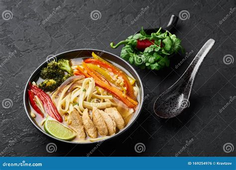 Chicken Thukpa in Black Bowl at Dark Slate Background. Chicken Thukpa is Tibetan Cuisine Noodle ...