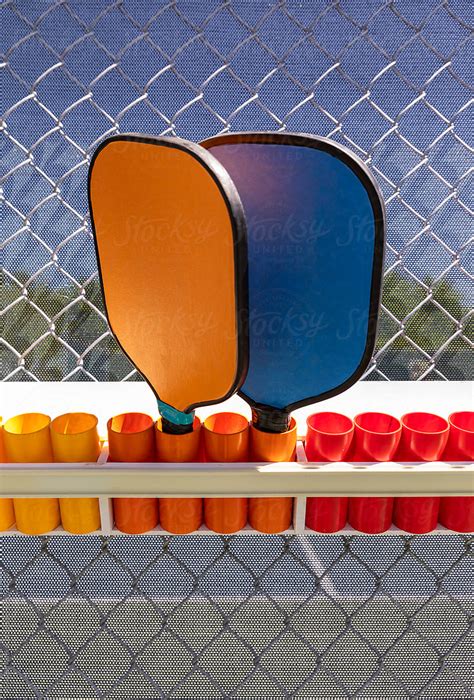 "Pickleball Court With Paddle Rack" by Stocksy Contributor "Raymond Forbes LLC" - Stocksy