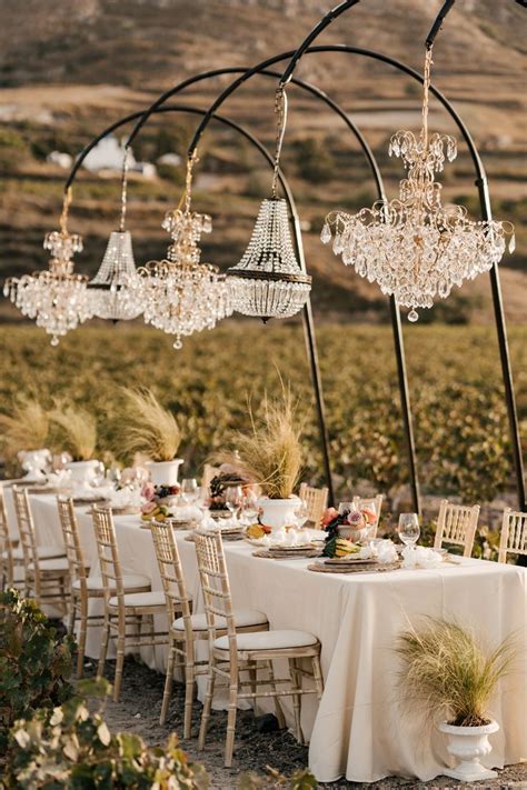 Chandelier Dinner Set Up Among Vineyards For Santorini Intimate Wedding