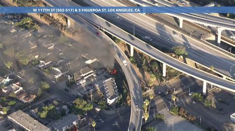 Firefighters extinguish another fire underneath another Los Angeles freeway