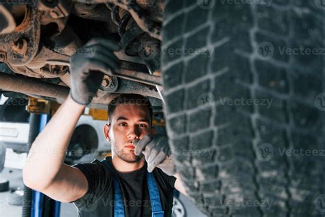 Auto Mechanic Working In Garage Repair Service Stock Photo At