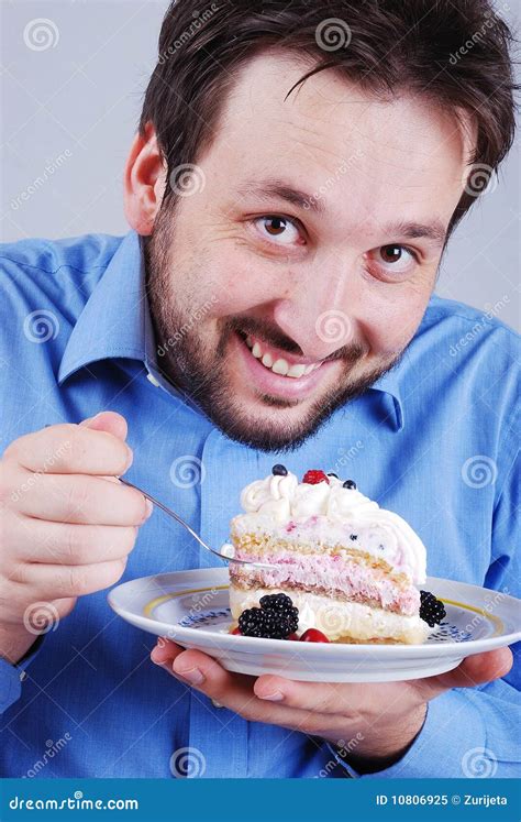 Young Man Eating Colorful Cake Isolated Stock Image Image Of Forties