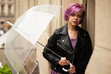 Premium Photo Cheerful Pretty Girl Holding Umbrella While Strolling