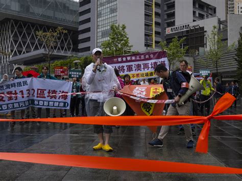 Protesters were required to wear numbered badges at a Hong Kong ...