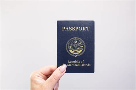 Passport Marshall Islands Held Against Simple White Background. Astana