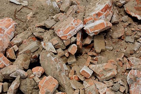 Pile Of Broken Red Bricks On Construction Site Photo Background And