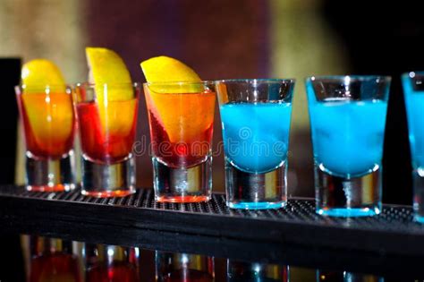 Several Alcoholic Shots Of Diferent Drinks At A Party Stock Photo