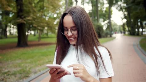 Student Scrolling On Her Phone Stock Video Motion Array